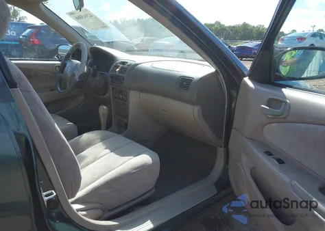 2000 Toyota Corolla Le z USA, uszkodzony, nr VIN 2T1BR12E7YC354029